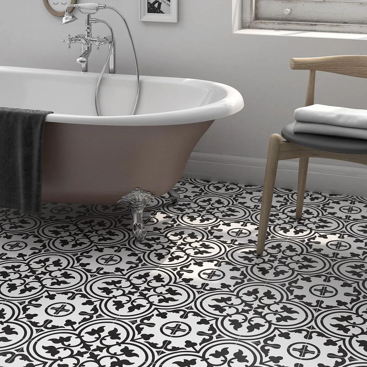 Arco Collection: black and white patterned floor tiles beside a freestanding bath