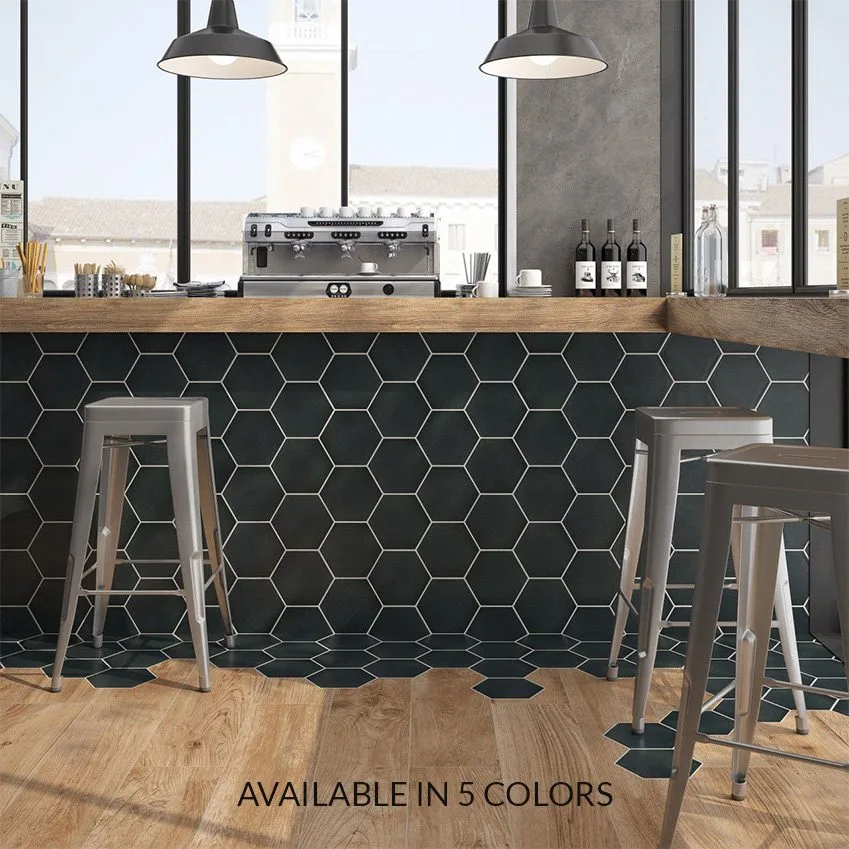 Hive Series: dark hexagonal tiles on a bar front with wooden stools